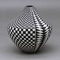 A black on white tear drop jar decorated with a four-panel checkerboard and geometric design
 by Cletus Victorino of Acoma