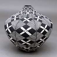 A high-shouldered black on white jar decorated with a stylized checkerboard, fineline and geometric design
 by Sandra Victorino of Acoma