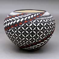 A polychrome jar decorated around the body with a painted checkerboard, yucca-leaf snowflake, feather and geometric design
 by Sandra Victorino of Acoma