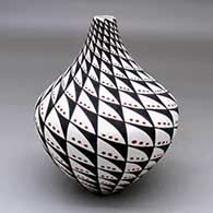 A polychrome tear drop jar decorated with a snowflake and spiral mesa geometric design
 by Sandra Victorino of Acoma