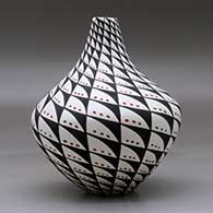 A polychrome tear drop jar decorated with a spiral mesa, snowflake and geometric design, click or tap to see a larger version