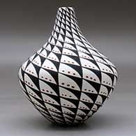 A polychrome tear drop jar decorated with a spiral mesa, snowflake and geometric design, click or tap to see a larger version
