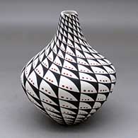Click for a larger view A polychrome tear drop jar decorated with a spiral mesa, snowflake and geometric design
by Sandra Victorino of Acoma