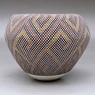 A polychrome jar with an Infinity rim and decorated with a geometric design built of tiny squares, click or tap to see a larger version