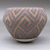 A polychrome jar with an Infinity rim and decorated with a geometric design built of tiny squares, click or tap to see a larger version