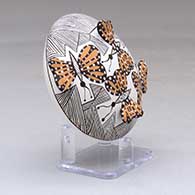 A polychrome seed pot decorated with butterfly wing appliques and a butterfly, fineline and geometric design, click or tap to see a larger version