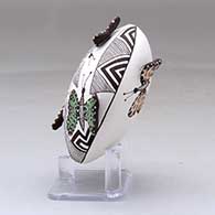 A polychrome seed pot decorated with butterfly wing appliques and a butterfly, fineline and geometric design, click or tap to see a larger version