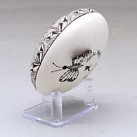 A black on white seed pot decorated with a butterfly wing applique and a butterfly, fineline and geometric design, click or tap to see a larger version