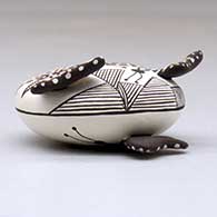 A miniature polychrome seed pot decorated with butterfly wing appliques and a butterfly, fineline and geometric design, click or tap to see a larger version