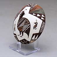 A polychrome seed pot decorated with quail head and lady bug appliques and a quail family and geometric design, click or tap to see a larger version