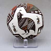 A polychrome seed pot decorated with quail head and lady bug appliques and a quail family and geometric design
 by Carolyn Concho of Acoma