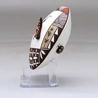 A polychrome seed pot decorated with butterfly wing and lady bug appliques and a butterfly, fineline, checkerboard and geometric design, click or tap to see a larger version