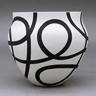A black on white bowl decorated with a flowing geometric design, click or tap to see a larger version