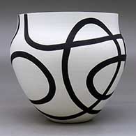 A black on white bowl decorated with a flowing geometric design, click or tap to see a larger version