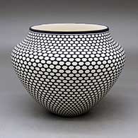A high-shouldered black on white jar decorated around the body with a geometric design
 by Paula Estevan of Acoma