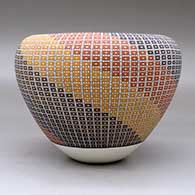 A polychrome jar with an Infinity rim and decorated with a geometric design built of tiny squares, click or tap to see a larger version