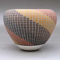 A polychrome jar with an Infinity rim and decorated with a geometric design built of tiny squares, click or tap to see a larger version