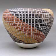 A polychrome jar with an Infinity rim and decorated with a geometric design built of tiny squares, click or tap to see a larger version