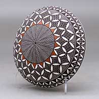 A polychrome seed pot decorated with a North Star fineline, yucca leaf snowflake and geometric design above the shoulder, click or tap to see a larger version