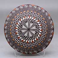 Click for a larger view A polychrome seed pot decorated above the shoulder with a fineline and geometric design
by Rebecca Lucario of Acoma