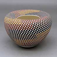 Click for a larger view A polychrome Infinity bowl decorated from top to bottom with a spiraling geometric design
by Frederica Antonio of Acoma