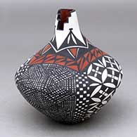 A polychrome tear drop jar with a kiva step cut opening and decorated with a four panel checkerboard, fineline and geometric design
 by Sandra Victorino of Acoma