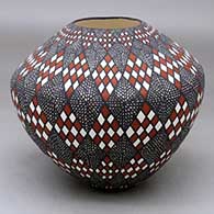 Click for a larger view A polychrome jar decorated with a stylized checkerboard and fineline geometric design
by Sandra Victorino of Acoma