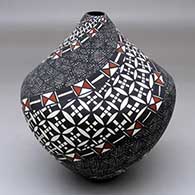 A polychrome tear drop jar decorated with a spiral fineline and geometric design
 by Sandra Victorino of Acoma