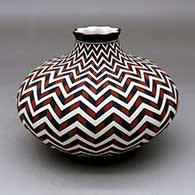Click for a larger view A polychrome jar with a short neck and pie crust rim, decorated with a lightning bolt and geometric design
by Paula Estevan of Acoma