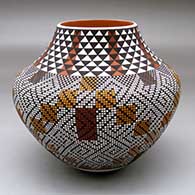 A polychrome jar decorated with a geometric design mostly built of filling in tiny squares in patterns
 by Frederica Antonio of Acoma