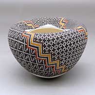 Click for a larger view A polychrome jar with an infinity rim and decorated with a four-panel geometric design built of filling in tiny squares in a grid
by Frederica Antonio of Acoma