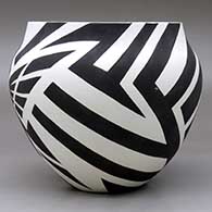 A black on white jar decorated with a hummingbird and geometric design, click or tap to see a larger version