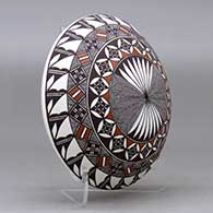 A polychrome seed pot decorated above the shoulder with a fineline, yucca leaf snowflake and geometric design, click or tap to see a larger version