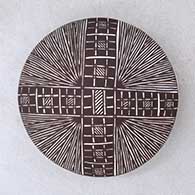 A black on white seed pot decorated above the shoulder with a fineline and geometric design
 by Amanda Lucario of Acoma