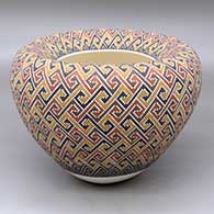 Click for a larger view A polychrome jar with an Infinity rim and decorated with a tiny square geometric design
by Frederica Antonio of Acoma
