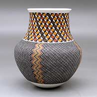 A polychrome jar with a recurved neck and decorated with a four panel tiny square geometric design below the neck and a 3D geometric design around the neck, click or tap to see a larger version