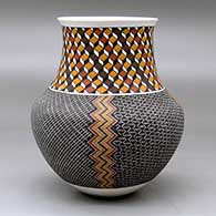 A polychrome jar with a recurved neck and decorated with a four panel tiny square geometric design below the neck and a 3D geometric design around the neck, click or tap to see a larger version