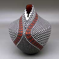 Click for a larger view A large polychrome tear drop jar with a kiva step cut opening and decorated with a checkerboard and geometric design
by Sandra Victorino of Acoma