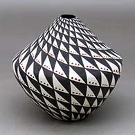 Click for a larger view A polychrome jar with a narrow opening and decorated with a spiral mesa and snowflake geometric design
by Sandra Victorino of Acoma