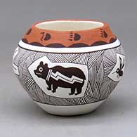 A small polychrome jar decorated with four medallions enclosing a bear, mosquito, rabbit and lizard surrounded by fineline graphic design
 by Judy Lewis of Acoma