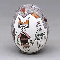 A polychrome seed pot decorated with medallions enclosing a pair of pueblo dancers and two cornstalks, surrounded by fineline and geometric design
 by Judy Lewis of Acoma