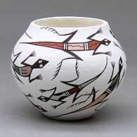 A small polychrome jar decorated with a multitude of lizards with geometric designs
 by Judy Lewis of Acoma