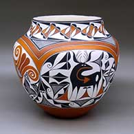 Click for a larger view A large polychrome jar decorated with a four panel double rainbow, deer-with-heart-line, parrot, fineline and geometric design
by Adrian Trujillo of Acoma