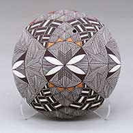 A polychrome seed pot decorated on top with a fineline and geometric design
 by Shaylene Chino of Acoma
