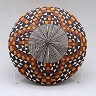 A polychrome seed pot decorated above the shoulder with a fineline, checkerboard and geometric design
 by Sharon Lewis of Acoma