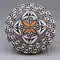 A polychrome seed pot decorated above the shoulder with a geometric design
 by Sharon Lewis of Acoma