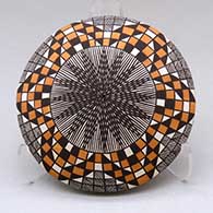 A polychrome seed pot decorated above the shoulder with a fineline, checkerboard and geometric design
 by Sharon Lewis of Acoma