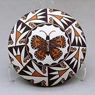 A polychrome seed pot decorated above the shoulder with a butterfly and geometric design
 by Sharon Lewis of Acoma
