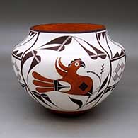 A polychrome jar decorated with a three panel parrot, flower, raincloud, and geometric design
 by Franklin Peters of Acoma