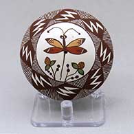 Click for a larger view A polychrome seed pot decorated with a dragonfly, plant, lightning bolt, fineline and geometric design
 by Diane Lewis of Acoma